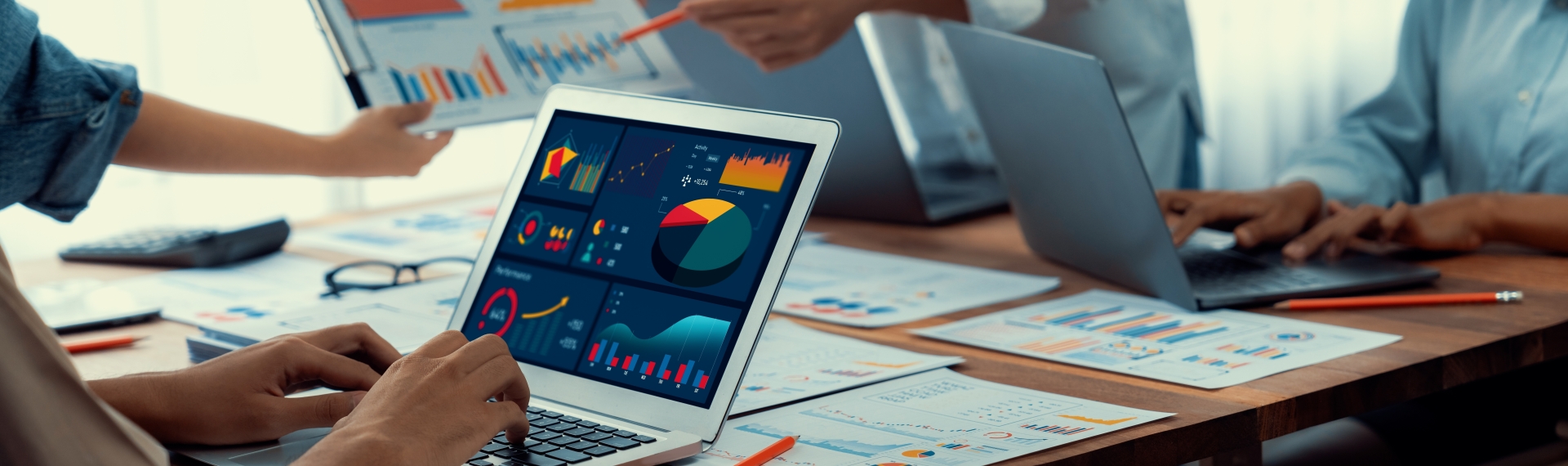 Person working at Laptop showing Data Charts